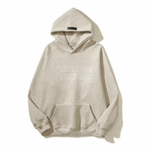 a hoodie that says essentials fear of god