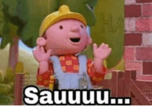 bob the builder is standing in front of a brick building with his hands in the air and says sauuu .