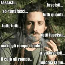 a man with dreadlocks is smoking a cigarette with a caption that says tutti fascisti