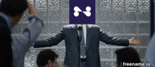 a man in a suit is giving a speech in front of a microphone with a n on his head .