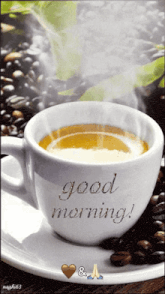 a cup of coffee with steam coming out of it says good morning