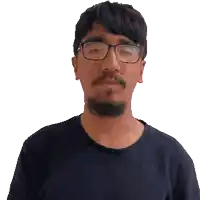 a man with glasses and a beard wearing a black shirt
