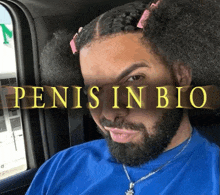 a man with a beard is sitting in a car with the words penis in bio on the bottom