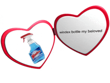 a heart shaped mirror with a windex bottle inside