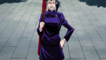 a woman in a purple dress and glasses is holding a red flag