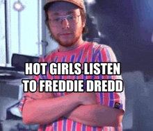 a man with glasses and a hat is standing with his arms crossed and says hot girls listen to freddie dredd