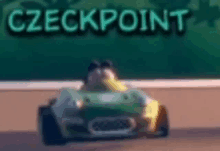 a cartoon character is driving a green race car on a race track .