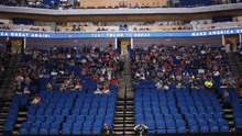 an empty stadium with a sign that says text trump to 88032