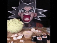 a person with a cartoon face painted on their face is sitting at a table eating sushi .