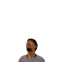a man with glasses and a beard looks up at the number ten