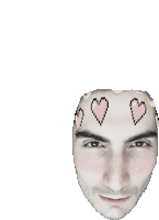 a man 's face with three pink hearts on it