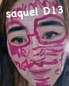 a girl with pink paint on her face has the name saquel d13 written above her