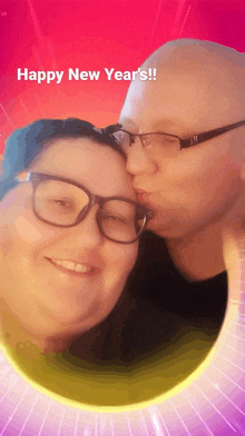 a man kissing a woman on the cheek with the words happy new year 's on the bottom