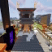 a blurry picture of a city in minecraft with a castle in the background .