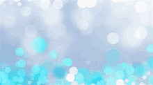 a blurred background with blue and white circles on it .