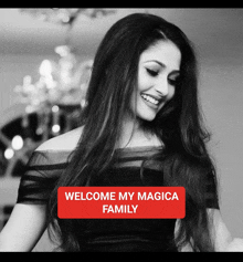 a black and white photo of a smiling woman with the words welcome my magica family