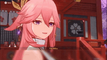 a girl with pink hair and purple eyes is talking to yae miko in a video game .