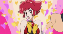 a girl with red hair and yellow gloves is tied up