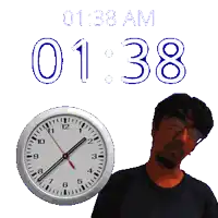a man stands in front of a clock that says 1:38 am