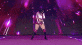 a woman is dancing on a stage in front of a purple background with the letter r on it .