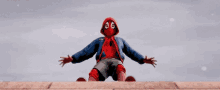 a cartoon spider-man is sitting on the ground with his arms outstretched in the air .