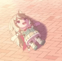 a doll is laying on the ground on a brick walkway .