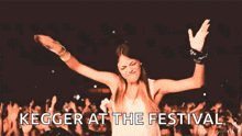 a woman is dancing in front of a crowd at a festival with the words kegger at the festival above her