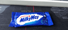 a milky way candy bar is sitting on a map of south africa