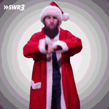 a man in a santa claus costume with swr3 on the bottom