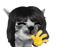 a cat with a wig on has a yellow hand in front of it