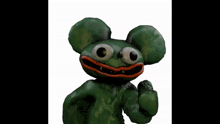a picture of a green stuffed animal with big eyes and a red mouth
