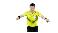 a referee is wearing a yellow shirt that says fifa