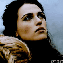 a close up of a woman 's face with katiegifs written below her