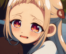 a close up of a girl 's face with tears running down her cheeks