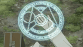 a person 's hand is holding a circle with a foreign language written on it