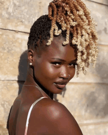 a close up of a woman 's face with blonde hair