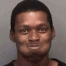 a close up of a man 's face with a slight smile on his face .