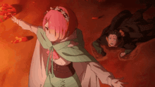 a girl in a green cape is standing next to a man in a black cape .