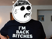 a man wearing a shirt that says " i 'm back bitches "