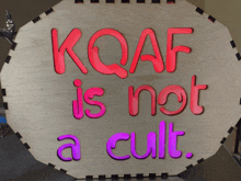 a sign that says kqaf is not a cult