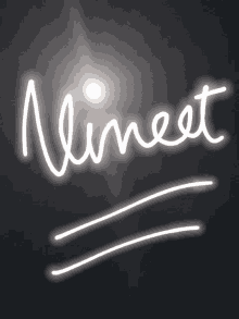 a neon sign that says ' nineest ' on it