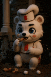 a stuffed animal with the letter b on its head