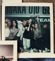 a group of people posing in front of a sign that says johnny wilde