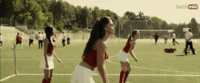 a group of girls are playing soccer on a field with icons hd written on the bottom of the screen