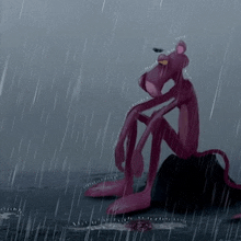 a pink panther is sitting in the rain on a rock