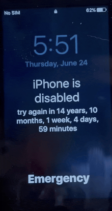 a phone screen that says iphone is disabled try again in 14 years 10 months 1 week 4 days 59 minutes and emergency