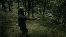 a person in a bear mask holding a gun in a forest