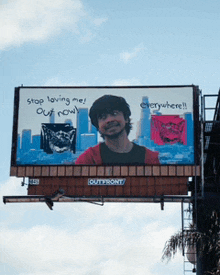 a billboard that says " stop loving me out now " on it