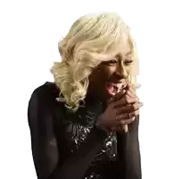 a woman with blonde hair and a black top is laughing