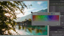 a computer screen shows a picture of a lake with a rainbow of colors